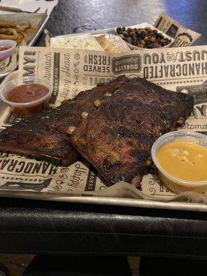 full rack of St Louis ribs with baked beans, potato salad and corn bread