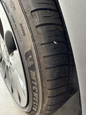 Tesla tire with nail embedded near the side wall.