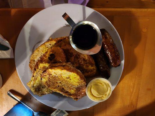 Brioche French Toast with whipped butter and warmed syrup.