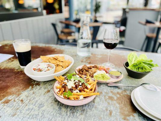 Happy Hour - Carnitas Lettuce Wraps, Guacamole and Chips, Poutine Fries with chunks of Carnitas