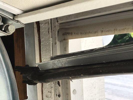 Rubber seal and metal rail at bottom door edge falling off. Not a warranted repair per Garage Doors Unlimited-buyer beware.