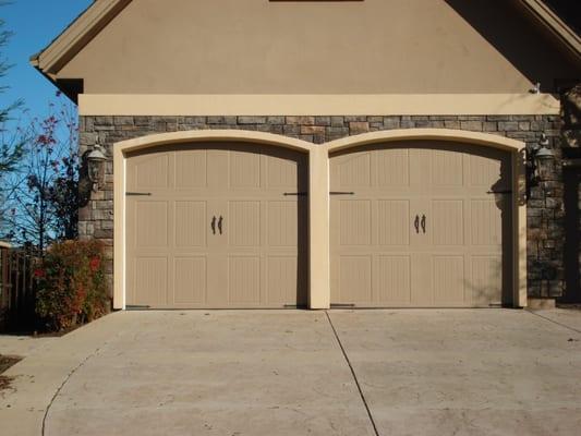 Steel carriage house style sectional garage doors