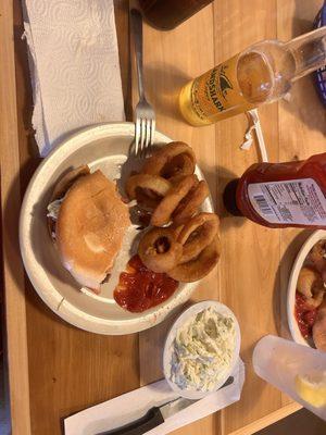 Cheeseburger and onion rings with coleslaw