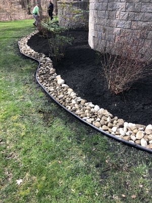 Landscape with river stones Around the flowerbeds