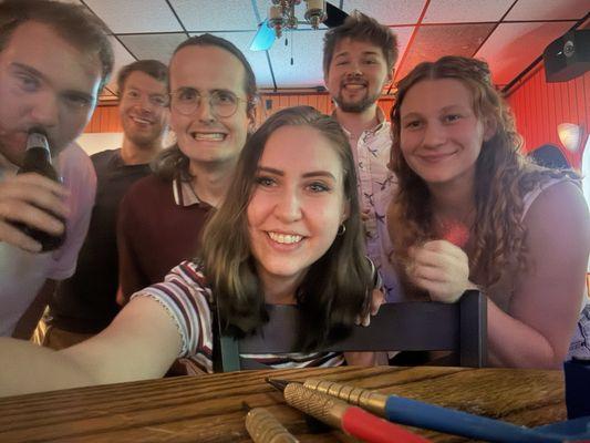 Group in the back bar area by dart boards