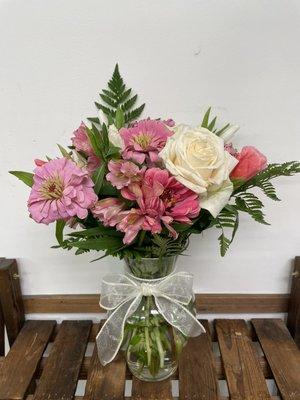 Pretty and Pink arrangement in a fluted vase.  S/M/L