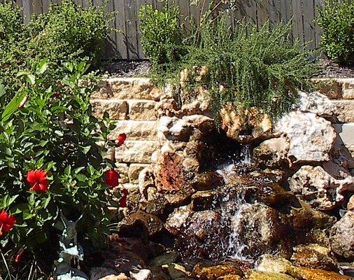 Fountains and flowers, the perfect Texas summer pair. landscape123.com