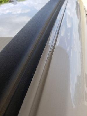 This is how they "fixed" the protruding dent they made. Hammered it flat and then touch up paint. On a brand new car with 700 miles on it.