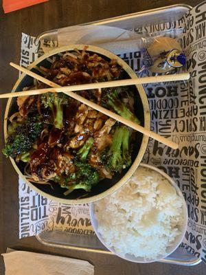 White rice, broccoli, carrots, chicken, garlic butter noodles with teriyaki sauce.