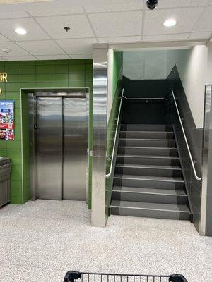 Stairs and elevator to get to second floor cafe.