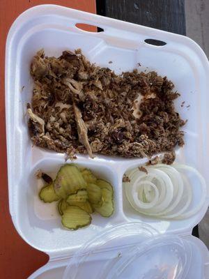 Plate with two meats, pickles and onion sides