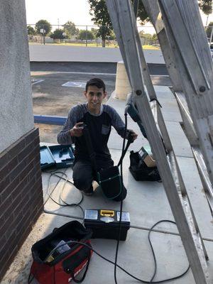 Daniel helping install IP cameras in Ontario