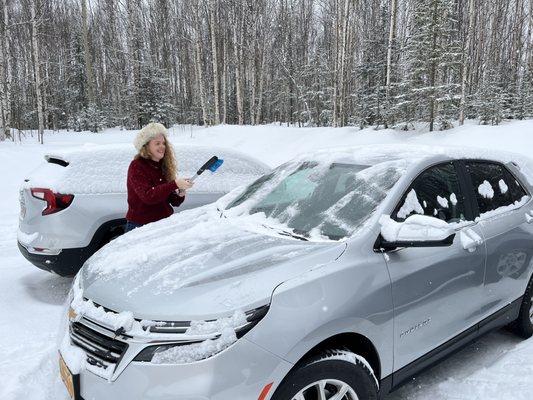 Scraping snow off the Equinox, a daily duty for us!