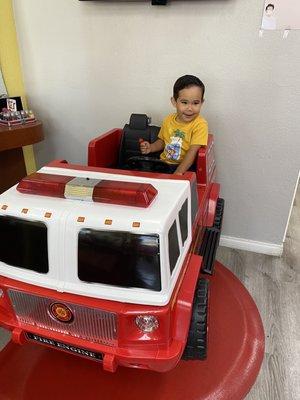 After his haircut, Ana let him play in the truck!