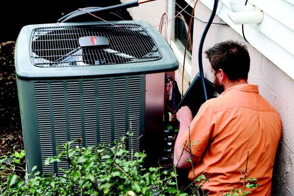 Technician Installing New Amana Air Conditioner