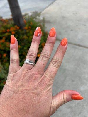 Dip manicure, almond shaped with flower design on ring fingernail