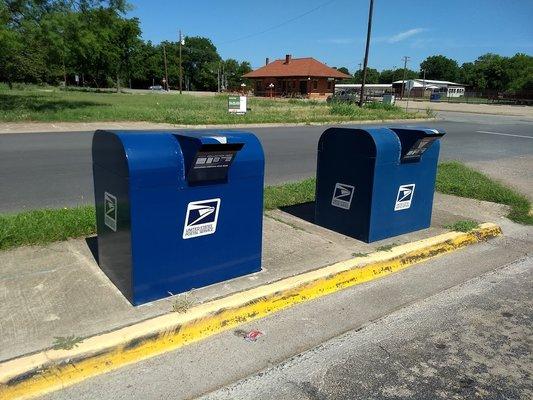 Why does this small post office need two giant mailboxes?