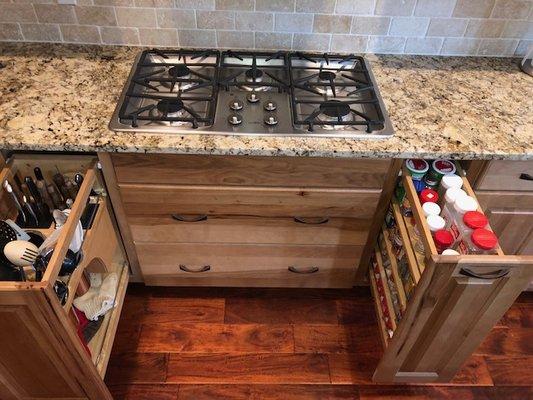 Deep drawers, spice pull outs and utensil pull out add function to this kitchen!