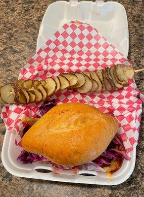 MeMe's Twisted Potato - vegan brisket sandwich and side of twisted potato.