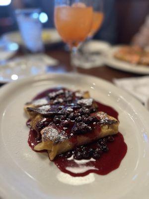 Lemon ricotta blintz with huckleberries