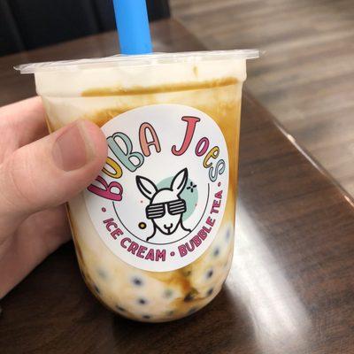 Signature brown sugar milk tea with blueberry popping bubbles