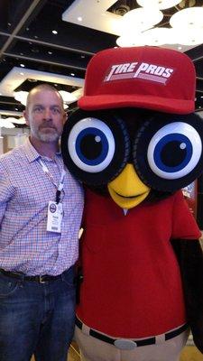 Hank Phillips, owner, with Hootie, Tire Pros mascot.