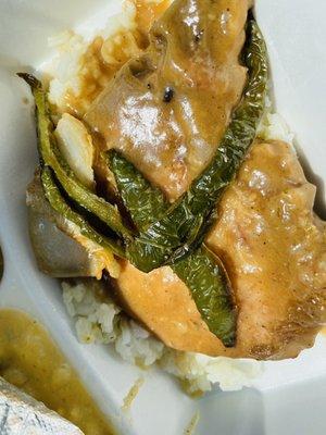 My husbands smothered pork chop with gravy over rice! #Delish