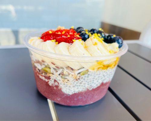 Acai Bowl Acai, chia pudding, pumpkin seeds, granola, almonds, banana, blue berry, strawberry, honey and bee pollen