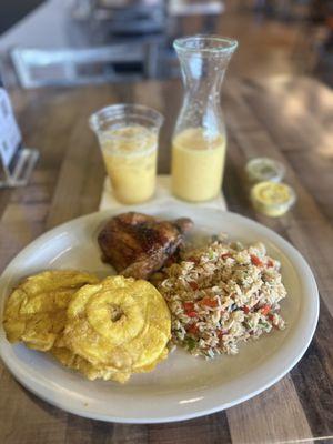 1/4 Dark Meat with Veggie Rice and Tostones. Fresh Mango Natural Juice