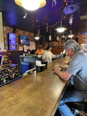 The regular crowd. You can always spot them hanging at the far right of the bar.