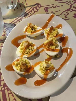 Deviled eggs with chicken on top extremely good