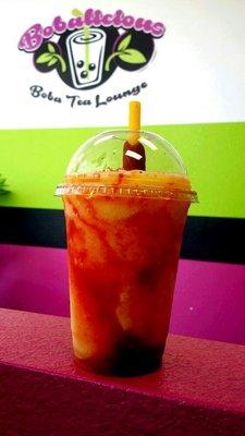 "Spicy Mango" Green Tea Mango Slush with Chamoy, topped with mango gelly and a Tamarindo Stick