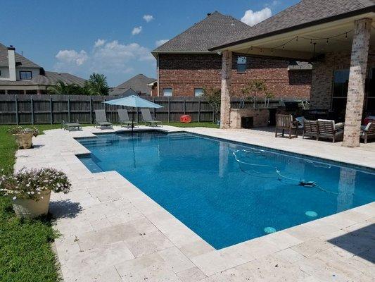 16'x32' rectangular pool with dyed Blue plaster, Travertine pavers, deck jets, 2 sets of steps with a big play ledge for the kids.