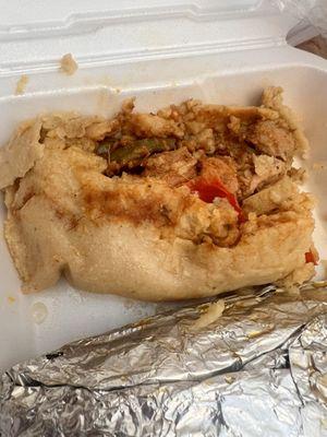 Chicken Tamale I took to go. It had pieces of potato and Chiles (not spicy). It was melt in your mouth!