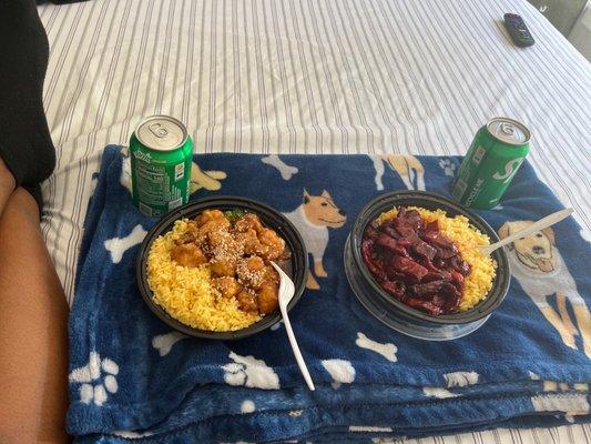 Sesame chicken and boneless ribs  both with yellow rice