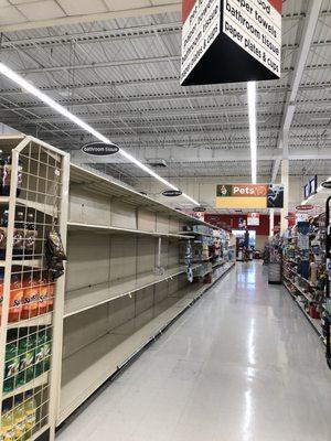 Shoppers aisle that previously displayed toilet paper and paper towels