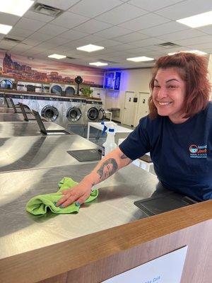 The place is super clean and here is the friendly lady cleaning it!