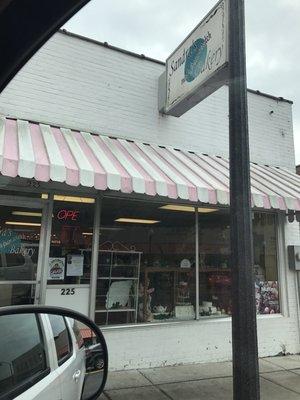 Cute pink and white awning.