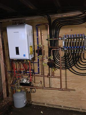 High efficiency wall hung combination boiler with radiant in floor heating