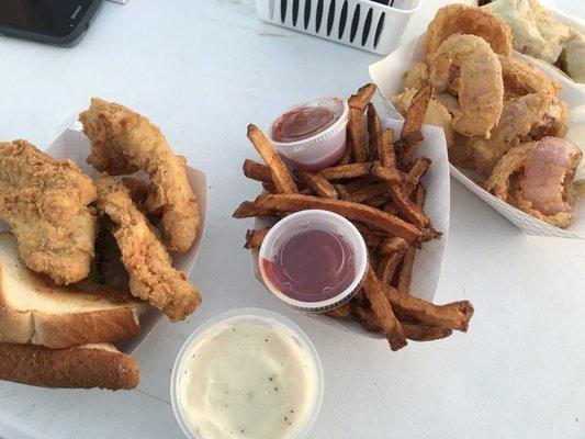 Chicken strips and steak fingers and fries. TSU onion rings ( purple onions). Brisket burrito. Great food!!!!!