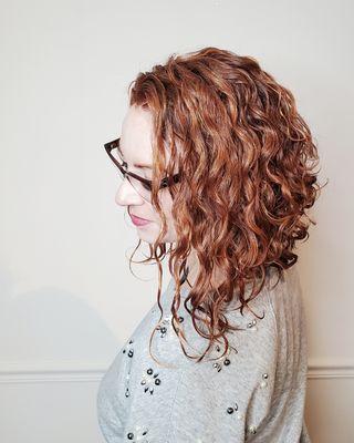 Balayage highlights to Softly brighten for summer, curly cut, curl styling and diffusing to define and enhance her curls!