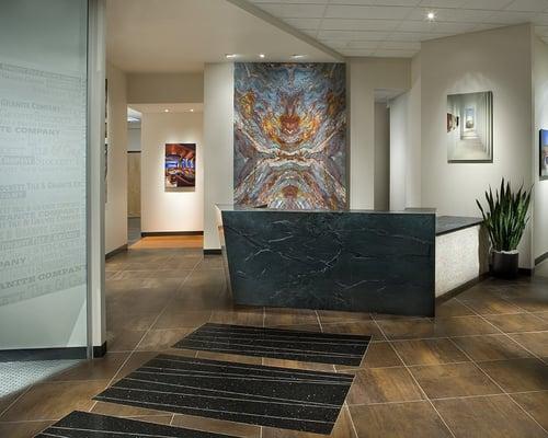 Stockett Tile & Granite's front desk.  Book match & veined matched granite.