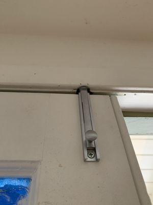 Adding a surface bolt to the top of a French door for added security.