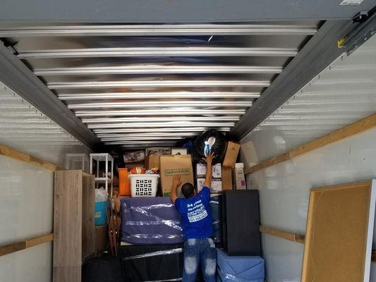 Movers packing truck for interstate move