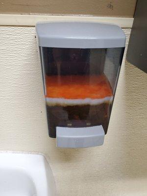 Unsettling soap dispenser