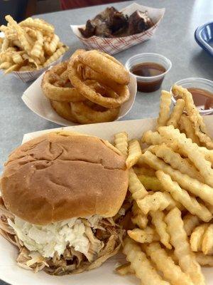 Smoked chicken piled high with vinegar slaw, fries, onion rings, bbq ribs