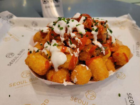 K-Tots ($8 - Tater tots topped with melted cheese, kimchi, hot sauce, sour cream, pico de gallo, and chives).