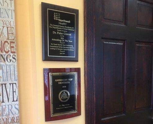 Dr. Glavas accolades displayed in his Mineola office.