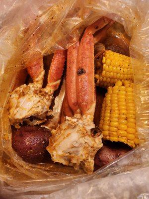 Lb of snowcrab legs, corn, and potatoes  with all flavors mixed.