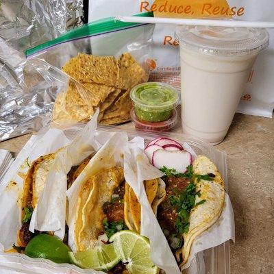 Takeaway: two pastor and two chorizo tacos, with medium horchata.